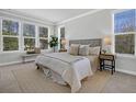 Bright and airy bedroom featuring multiple windows, neutral décor, and stylish furnishings at 123 Brown Swiss Cir, Summerville, SC 29483