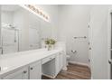 Clean bathroom featuring double vanity, quartz countertop, and walk-in shower at 1362 Palm Cove Dr, Charleston, SC 29492