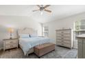 Serene primary bedroom with neutral tones, vaulted ceiling, and ample natural light at 1362 Palm Cove Dr, Charleston, SC 29492