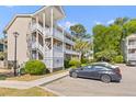 Exterior angle view of an apartment complex featuring a three-story building with balconies and parking lot at 1530 Fort Johnson Rd # 3C, Charleston, SC 29412
