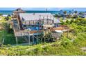 Coastal home with multi-tiered decks perfect for outdoor living with ocean view and easy beach access at 1604 E Ashley Ave, Folly Beach, SC 29439
