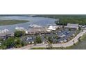 An aerial shot shows the marina's buildings, parking area, and several boats docked in the water at 1880 Andell Bluff Blvd # Slip E 9, Johns Island, SC 29455