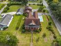 Sprawling property showcasing a home with a pool, lush landscaping, and a detached garage at 200 Broughton Rd, Moncks Corner, SC 29461