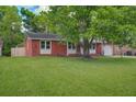 Well-maintained lawn and brick home showcasing a serene and inviting curb appeal at 201 Judith Dr, Summerville, SC 29485
