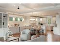 Open-concept living space features hardwood floors, natural lighting, and a modern eat-in kitchen at 3007 Cameron Blvd, Isle of Palms, SC 29451
