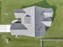 Aerial view of house and roof features and shows surrounding green lawn at 308 Cypress Branch Rd, Huger, SC 29450