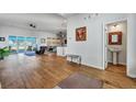 Bright living room showcasing hardwood floors, natural light, and an open-concept design at 308 Cypress Branch Rd, Huger, SC 29450