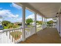 Spacious front porch with views of the marsh and nearby community at 3107 S Shore Dr, Charleston, SC 29407