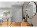 Inviting foyer with hardwood floors, modern decor, and natural light at 405 Cross St, Charleston, SC 29407