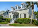 Beautiful two-story home with dormer windows and a metal roof at 41 Jane Jacobs St, Mount Pleasant, SC 29464