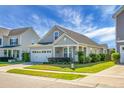 Well-maintained home with landscaped yard, two car garage, and inviting curb appeal at 411 Freeland Way, Moncks Corner, SC 29461