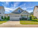 Well-maintained home with landscaped yard, two car garage, and inviting curb appeal at 411 Freeland Way, Moncks Corner, SC 29461