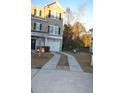 A split driveway leads to the attached garage of the townhome at 4210 Scharite St, Charleston, SC 29414