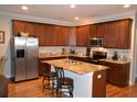A spacious kitchen featuring granite countertops, stainless steel appliances, and a central island at 4210 Scharite St, Charleston, SC 29414