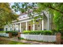 Elegant home exterior features a spacious porch with columns and a manicured front yard at 43 Montrose Rd, Mount Pleasant, SC 29464