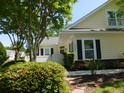 Charming home exterior featuring well-maintained landscaping and a welcoming entrance at 8800 Dorchester Rd # 2902, North Charleston, SC 29420