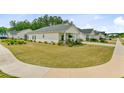 Well-manicured lawn complements this charming single-story home with a welcoming front porch in a peaceful neighborhood at 1003 Locals St, Summerville, SC 29485