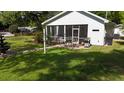 Outdoor dining on the screened porch and relaxing outdoor space at 104 Waccamaw Dr, Summerville, SC 29485