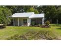 Well-maintained front yard with lush green grass and mature trees at 104 Waccamaw Dr, Summerville, SC 29485
