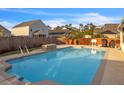 Inviting backyard pool area perfect for relaxation and entertainment, featuring a stone waterfall feature at 1097 Briar Rose Ln, Ladson, SC 29456