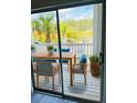 Inviting outdoor patio featuring a dining table, seating for four, and a view of lush greenery at 1300 Park West Blvd # 406, Mount Pleasant, SC 29466