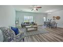 Spacious living room with modern furnishings and hardwood flooring at 131 Buchanan Cir, Goose Creek, SC 29445