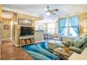 Bright and airy living room with comfortable seating, modern decor, and plenty of natural light at 1615 Chatelain Way, Mount Pleasant, SC 29464