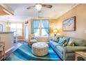 Comfortable living room with stylish furniture, a bright rug, and a view into the dining area at 1615 Chatelain Way, Mount Pleasant, SC 29464