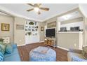 Cozy living room with built-in shelving, comfortable seating, and modern appliances in an open layout at 1615 Chatelain Way, Mount Pleasant, SC 29464