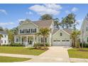 Beautiful two-story home with a two-car garage and a well-maintained front yard at 1755 Bolden Dr, Mount Pleasant, SC 29466