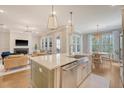 Open-concept kitchen with a large island, stainless steel appliances, and hardwood floors at 1755 Bolden Dr, Mount Pleasant, SC 29466