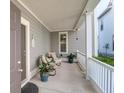 Cozy covered porch with seating, plants, and tranquil ambiance, perfect for relaxation at 1907 Mossdale Dr, Johns Island, SC 29455