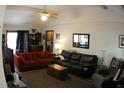 Comfortable living room featuring plush sofas, a ceiling fan, and natural lighting at 20 Anderson Ave, Charleston, SC 29412
