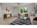 Cozy living room with a large window, stylish furnishings, and an eye-catching rug at 202 Resinwood Rd, Moncks Corner, SC 29461