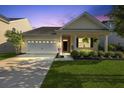 Charming single-story home with a well-maintained lawn and attached two-car garage at 218 Wexford Ct, Summerville, SC 29483