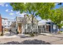 Street view of a charming home with mature trees, attractive curb appeal, and a gated entrance at 22 Sheppard St, Charleston, SC 29403