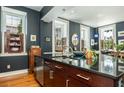 Gourmet kitchen with stainless steel appliances, granite countertops, and abundant natural light at 29 1/2 State St # B, Charleston, SC 29401