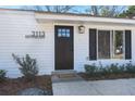 A welcoming front door with modern hardware and a stylish light fixture at 3113 Matipan Ave, North Charleston, SC 29405