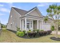 Attractive single-story home featuring a front porch and well-maintained landscaping at 315 Fish Creek Ct, Summerville, SC 29486