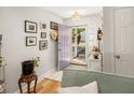 Light-filled foyer with a charming lavender door and stylish decor at 3222 Morningdale Dr, Mount Pleasant, SC 29466