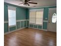 Living room with hard wood floors, windows with blinds, and custom trim at 3342 Habitat Blvd Blvd, Johns Island, SC 29455
