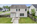 Back exterior view with a door, patio, and a partially fenced yard at 4747 Lewis And Clark Trl, Summerville, SC 29485
