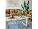 Tastefully designed living room with two couches, patterned rug, and stylish decorations creating a welcoming atmosphere at 4979 Lake Palmetto, North Charleston, SC 29418