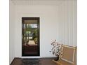 Welcoming front porch with a rocking chair, decorative accents, and a clear view through the door at 559 Eastern Isle Ave, Summerville, SC 29486