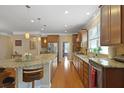 Spacious kitchen boasts granite countertops, stainless steel appliances, and a large center island at 559 Eastern Isle Ave, Summerville, SC 29486