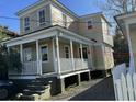 Quaint house featuring a classic front porch and a well-maintained yard at 8 Homel Pl, Charleston, SC 29403