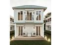 Inviting two-story home with a spacious outdoor patio area, perfect for entertaining guests at 8 Homel Pl, Charleston, SC 29403