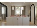 Modern kitchen island featuring marble countertop, gold hardware, and stylish pendant lighting at 8 Homel Pl, Charleston, SC 29403