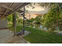Backyard features a spiral staircase, landscaping, and a beautiful view of the pond at 8483 Yadkin Cir # C, North Charleston, SC 29418