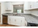 Updated kitchen with white cabinets, granite counters and stainless steel appliances at 8483 Yadkin Cir # C, North Charleston, SC 29418